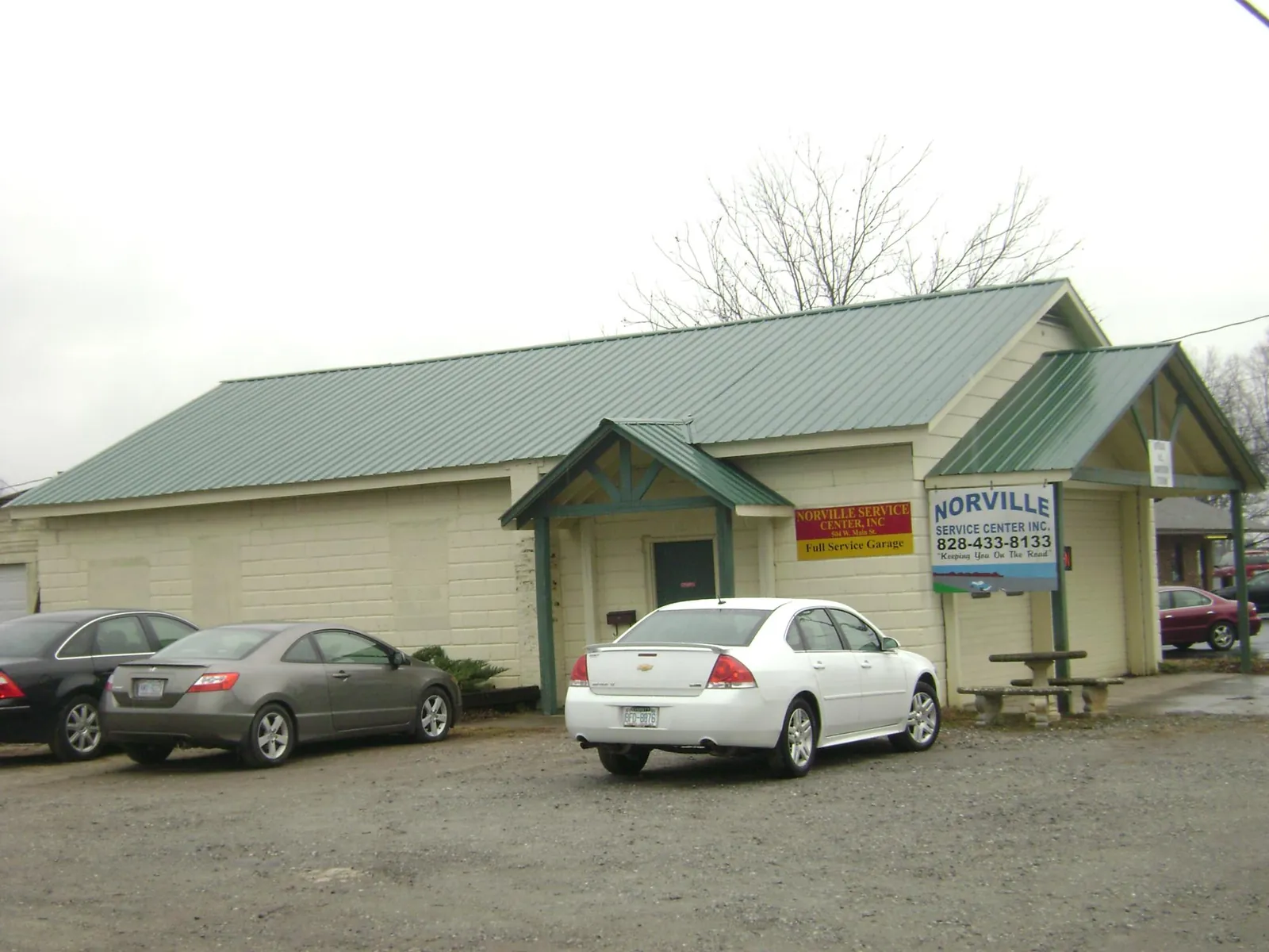 Green metal roof on a service garage with a covered entry in North Ridgeville